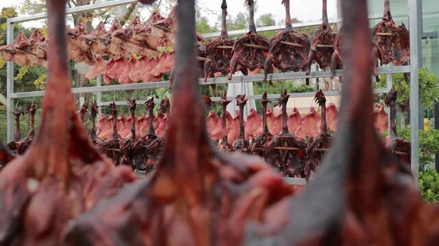 Poultry Processing Facility with Hanging Roasted Birds on Drying Racks