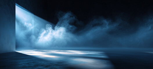 Fototapeta premium abstract blue spotlight on a dark background, with smoke and fog in a modern studio room with a concrete floor.