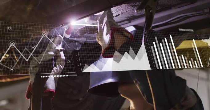 Female tech bringing torch, welding under car while AR charts growing around torch for auto repair