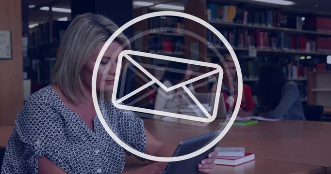 Female library patrons studying at study table, woman in patterned top using tablet with UI overlay