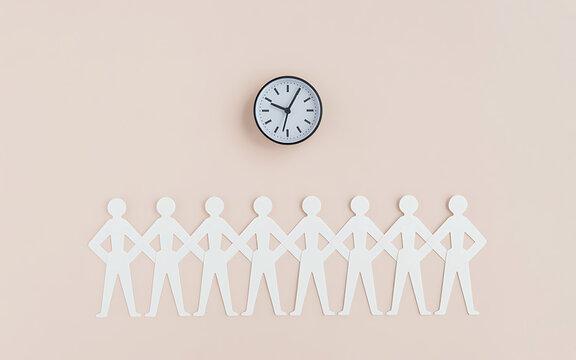 Paper chain figures representing a team standing together under a clock suggesting time management and unity