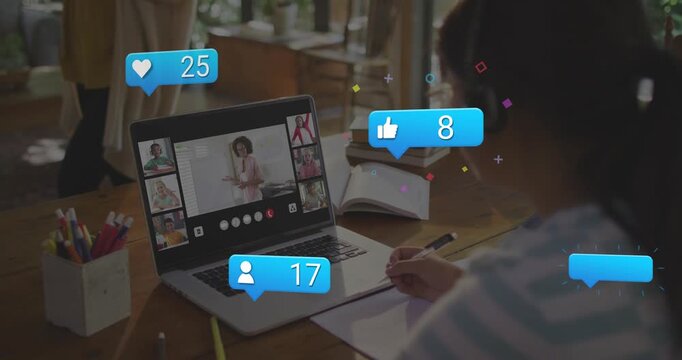 Education student noting at laptop on call, icons popping as faces reacting, spotting odd one out