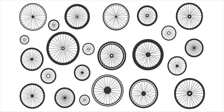 Assortment of bicycle wheels of various sizes and spoke patterns on a white background Keywords: bicycle, wheel, bike, cycle