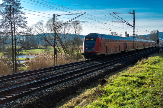 Germany &ndash; January 20, 2026: DB Regio double-deck control car moving along an electrified track on a sunny winter day