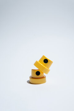 Yellow spray can caps on light background, graffiti industry details