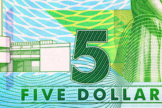 Close-up Denomination on 5 Dollar Trinidad and Tobago Banknote. Plastic money Trinidad and Tobago.