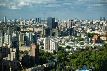 Obraz premium Moscow city skyline with Ostankino Tower, urban buildings, and green parks