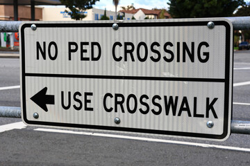 Fototapeta premium No Ped Crossing – Use Crosswalk traffic sign on city street
