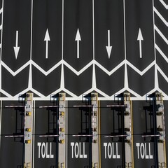 Obraz premium Aerial View Of Tollbooths With Directional Arrows And Painted Road Markings for Highway Traffic