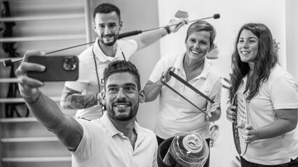 A group of osteopaths and physiotherapists taking selfie in their new studio