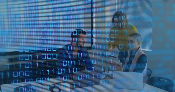 Team at meeting table leaning turning tablet toward laptop sharing tech data with binary overlay