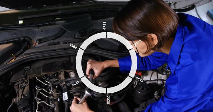 Female mechanic placing ratchet and causing HUD overlay while tightening fastener for car repair