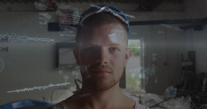Man standing facing camera in workshop, waveform sweep initiating HUD overlays for technology demo