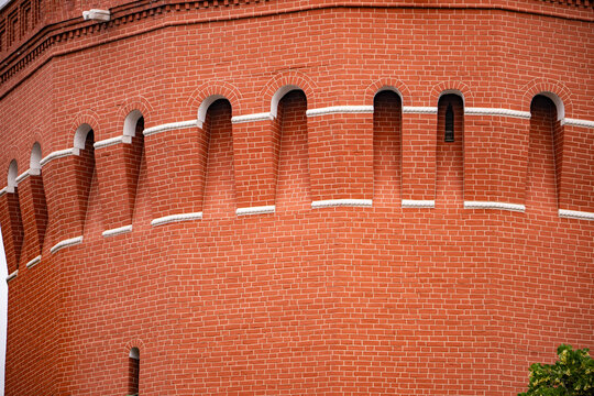 Historical Moscow Kremlin wall with red brick pattern and battlements