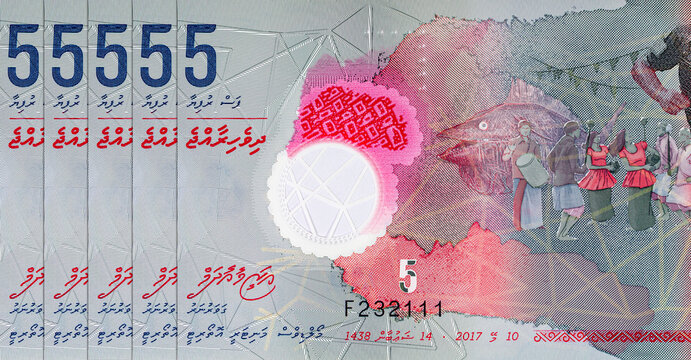 5 Rufiyaa of Maldives with the image of fragment Men playing football. Polymer money of Maldives.