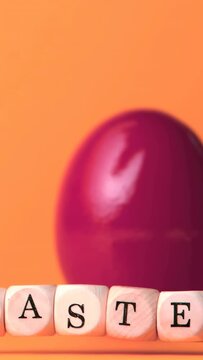 Vertical video: Confetti bursts sending magenta egg rotating and beads shifting, celebrating EASTER