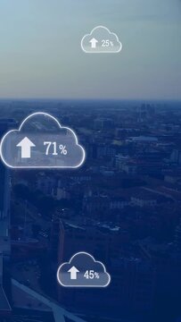 Vertical video: Cloud icons fading in and updating percentages over city for up-arrow sync progress