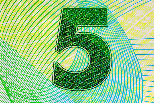 Close-up Denomination on 5 Dollar Trinidad and Tobago Banknote. Plastic money Trinidad and Tobago.