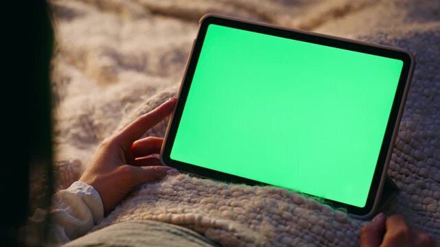 Finger tapping green screen tablet turning on online application closeup. 