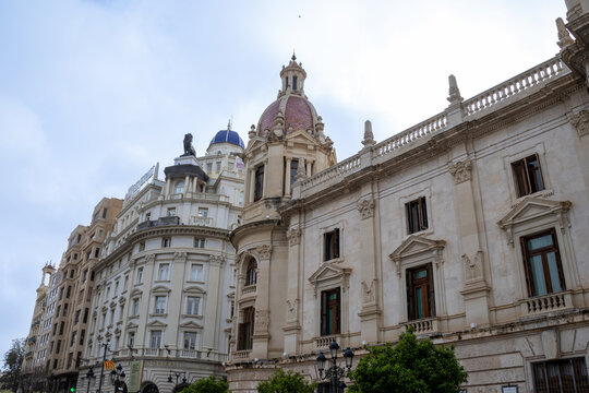Valencia City Hall in Plaza del Ayuntamiento during Fallas. Crowds gather for the Masclet&agrave;, a thunderous firework show, safely watched from behind the protective cage