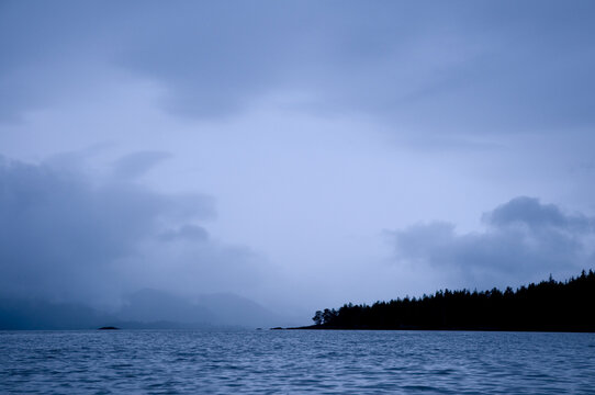 Canada, BC, Queen Charlotte Islands, Gwaii Haanas National Park.  Threatening skies over the islands.