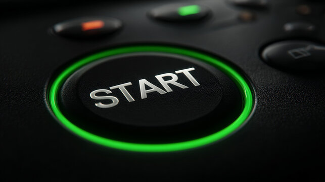 Start button green light gaming console power symbol closeup black background glowing circle game controller technology modern design green illuminated start button gaming console surface glows