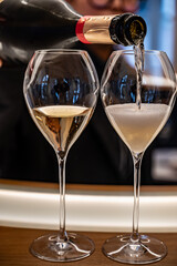 Champagne sparkling wine tasting tour, glasses of french champagne with little bubbles, visit of caves, Reims, France