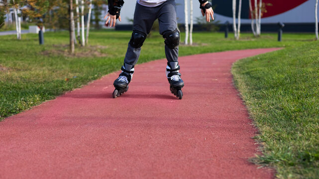 Roller skating, roller blader practicing balance in the Park