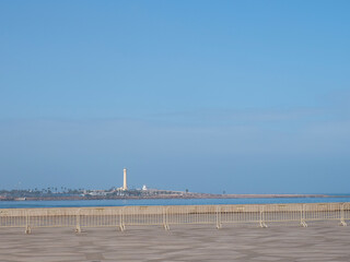 city beach and El Hank lighthouse (Pointe d'el-Hank Light), located on cap El Hank, Casablanca, Morocco