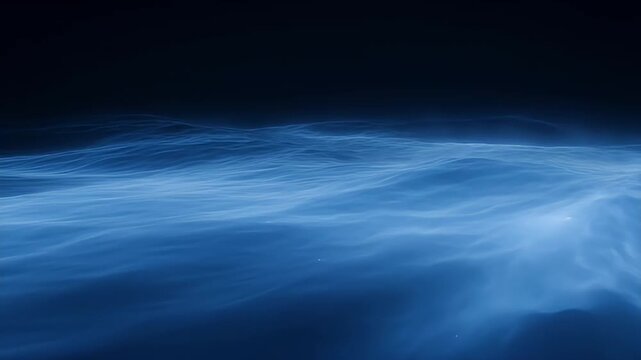 Abstract blue water waves against a dark background creating a digital ocean