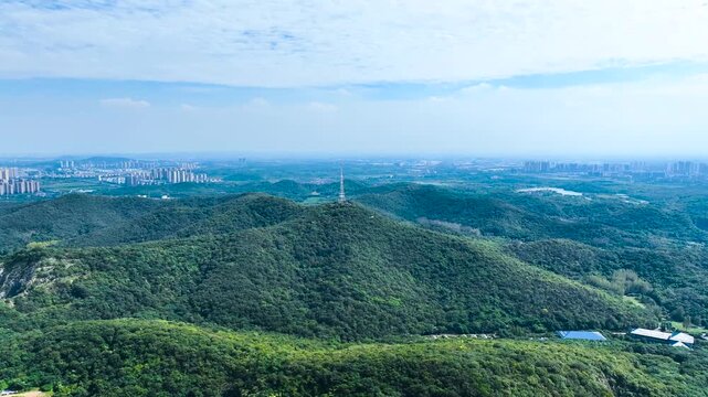 Zhenjiang Nanshan Scenic Area - Forested Mountains and City Skyline
