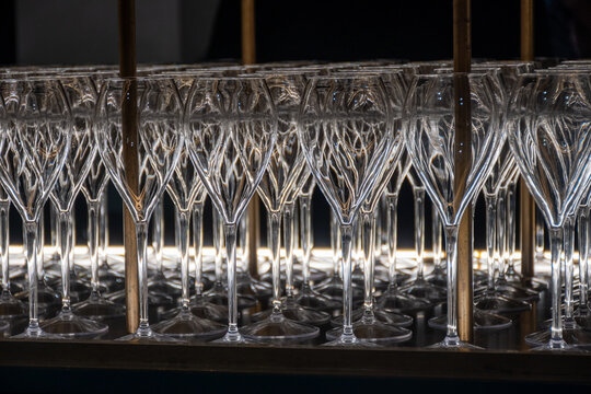 Many empty glasses for french sparkling wine champagne, cava, tasting of wine, bar, celebration, wedding or champagne tour with visit of caves, Reims, France