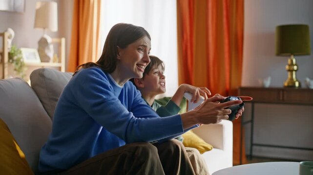 Emotional parent child gaming together frustrated online loss home closeup. 