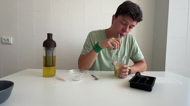 Man meticulously stirring drink sample with attentive focus