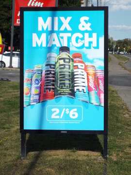 Ottawa, Ontario, Canada-July 17, 2025: A colorful "Mix & Match" sign offers Prime Hydration and Alani Nu drinks for two for six dollars on Hunt Club Rd.
