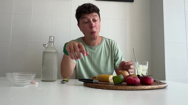 Caucasian man taste tester reacting to sour lime challenge