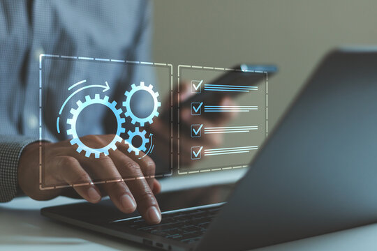 Business process automation concept with digital checklist and gear icons over laptop and smartphone. Workflow management, productivity improvement, task tracking, operational efficiency technology.
