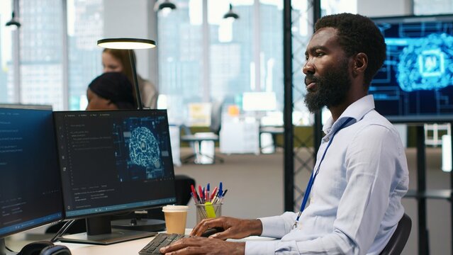 Software developer writing code on PC, developing deep learning APIs. IT professional using computer to troubleshoot software errors using artificial intelligence technology, camera A