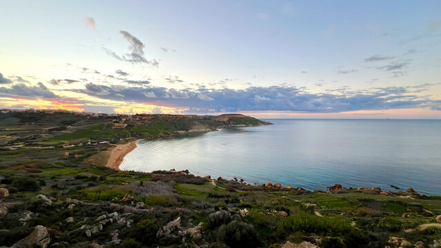 Ramla bay on gozo island at sunset showing mediterranean sea and coastline