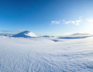 Vast Snow-Covered Landscape Under a Bright Blue Sky with Distant Mountains.