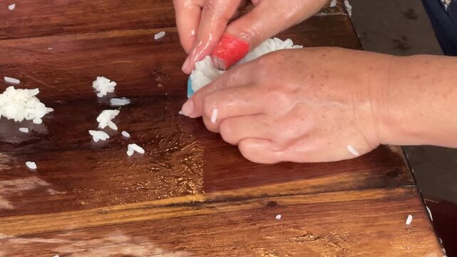 Closeup of a Woman Making Traditional Laos Rice Crackers (Khao Kop)