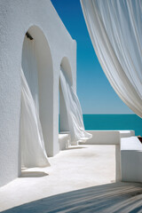 Fototapeta premium Minimal Mediterranean terrace with flowing white linen curtains framing a turquoise sea view, calm summer breeze moving sheer drapes in bright natural sunlight
