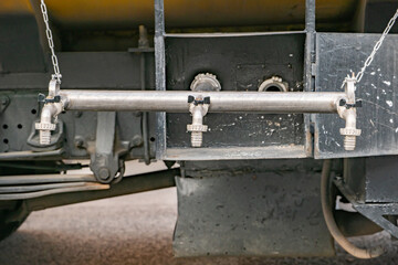 Water tank truck providing multiple faucets for communal washing and liquid access