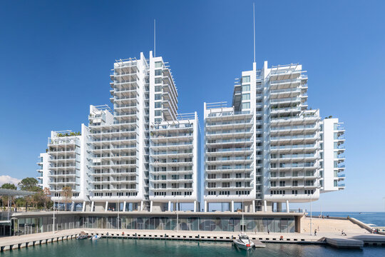 Monte Carlo, Monaco - May 10th 2025 : View of the Le Portier district in Monaco, extension of the principality at sea with the Renzo building and the marina at the bottom of the building.