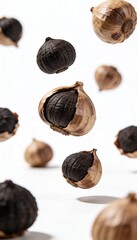 Black garlic bulbs levitating against a clean white background, showcasing their unique texture