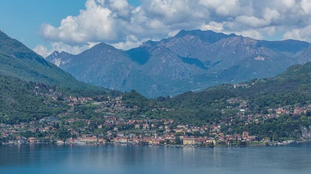 Time lapse, panoramic view on a lakeside town near lake. Lake Como, town Menaggio, Lombardy, Italy.
