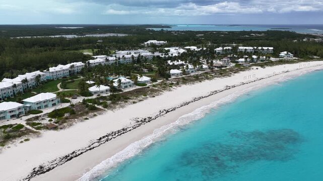 Aerial view of the closed Sandals Emerald Bay Exumas along the crescent-shaped white sands of Emerald Bay in the northern part of Great Exuma. 