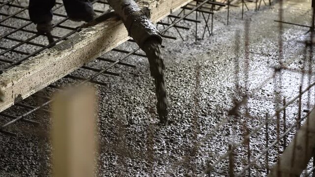 Concrete Pouring on Construction Foundation