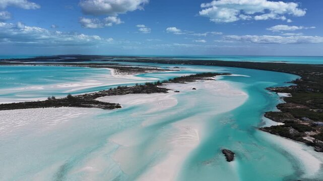 Aerial view of Man-O-War Cay in Moriah Harbour Cay National Park showing the island and sandbars in the Exumas, Bahamas.