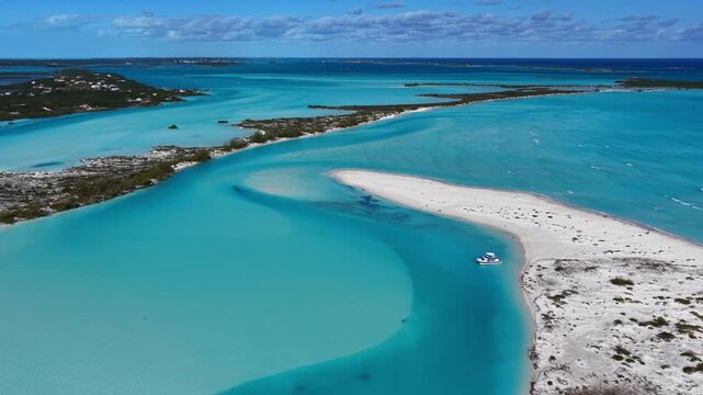 Aerial view of Man-O-War Cay in Moriah Harbour Cay National Park showing the island and sandbars in the Exumas, Bahamas.